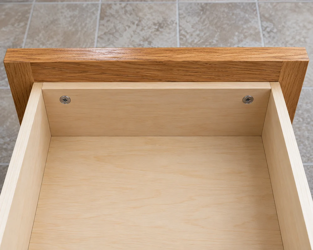 Drawer pulled out to show the attachment between its front and the drawer box